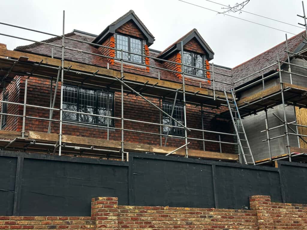 Brickworks Crawley 2 Roof renovation with scaffolding on a residential building.